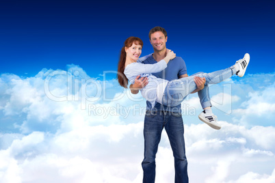 Composite image of man lifting up his girlfriend