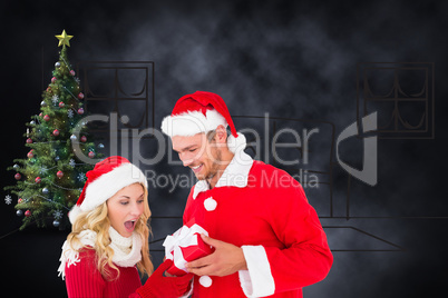 Composite image of young festive couple