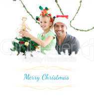 Composite image of happy father and daughter decorating together