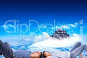 Composite image of couple lying on the floor