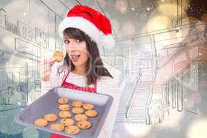 Composite image of brunette in santa hat showing hot cookies