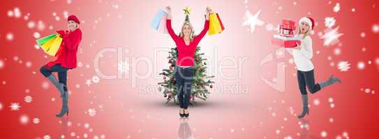 Composite image of happy blonde holding shopping bags