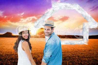 Composite image of happy hipster couple holding hands and smilin