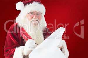 Composite image of santa claus writing on scroll