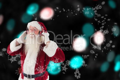 Composite image of santa claus enjoys some music