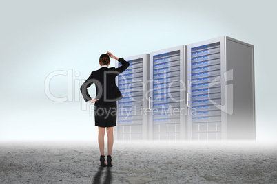 Composite image of young businesswoman standing and thinking