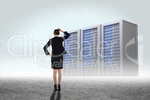 Composite image of young businesswoman standing and thinking