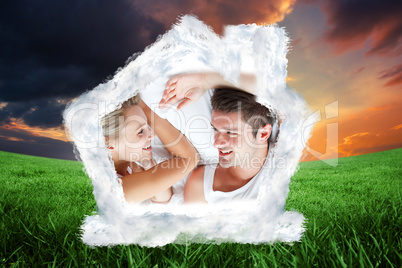 Composite image of couple relaxing in bed