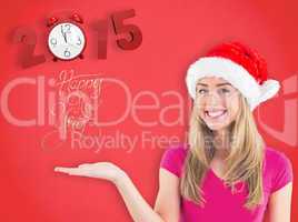 Composite image of festive blonde presenting with hand