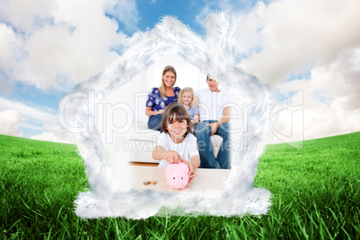 Composite image of cheerful little boy inserting coin in a piggy