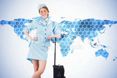 Composite image of pretty air hostess smiling at camera