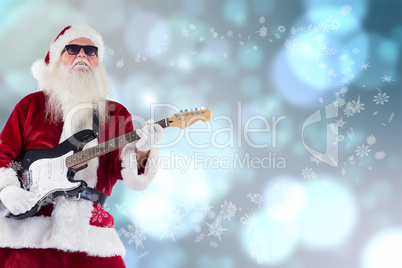 Composite image of santa claus plays guitar with sunglasses