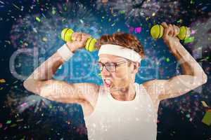 Composite image of geeky hipster posing in sportswear with dumbb