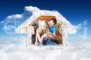 Composite image of cute lovers celebrating new house with champa