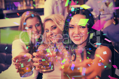 Composite image of pretty friends having a drink together