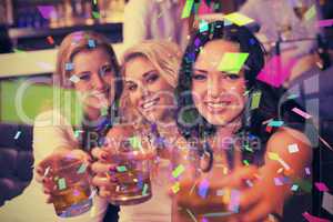 Composite image of pretty friends having a drink together