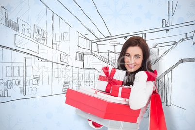 Composite image of joyful brunette holding christmas gifts and s