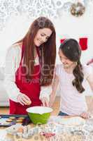 Composite image of festive mother and daughter baking together