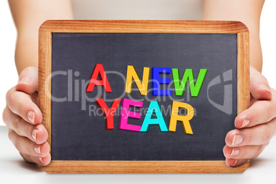 Composite image of females hands showing black board