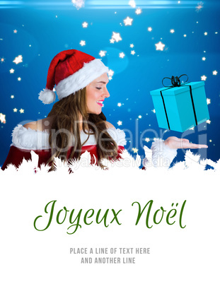 Composite image of pretty girl in santa costume holding hand out Composite image of pretty girl in santa costume holding hand out