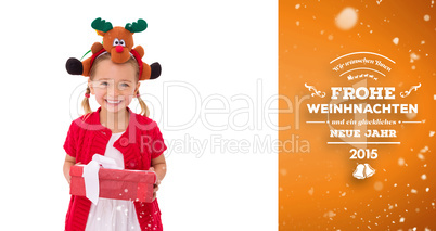 Composite image of cute little girl wearing rudolph headband