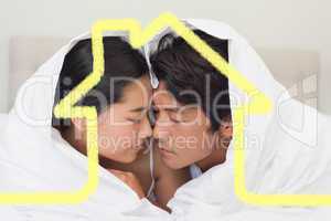 Composite image of happy couple lying on bed together under the