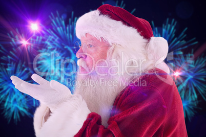 Composite image of santa claus blows something away