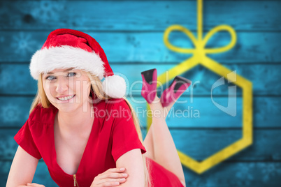 Composite image of festive blonde smiling at camera Composite image of festive blonde smiling at camera