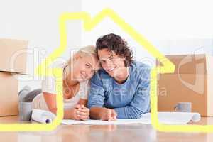 Composite image of couple organizing their future home