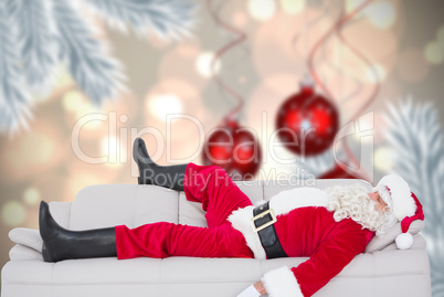 Composite image of santa claus sleeping on the couch