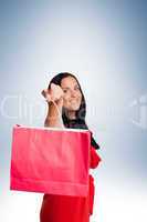 Woman standing with shopping bag