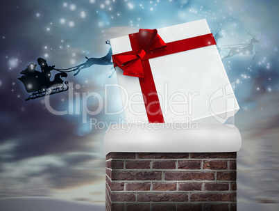 Composite image of santa flying his sleigh