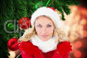 Composite image of happy festive blonde