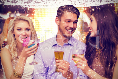 Composite image of friends toasting