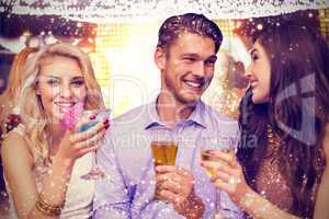 Composite image of friends toasting