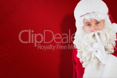 Composite image of portrait of santa keeping a secret