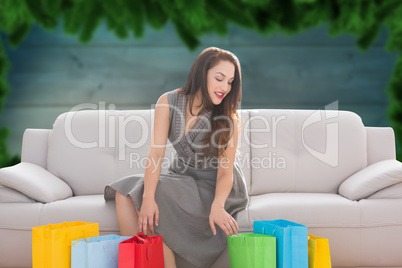 Composite image of woman with shopping bags