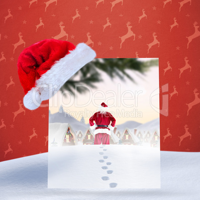 Composite image of santa delivery presents to village