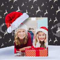 Composite image of festive little girl with mother surrounded by