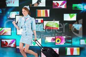 Composite image of pretty air hostess pulling suitcase