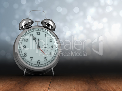 Composite image of alarm clock counting down to twelve