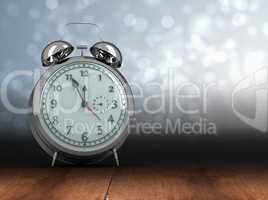 Composite image of alarm clock counting down to twelve