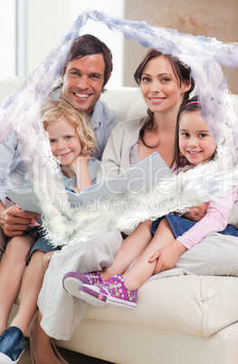 Composite image of portrait of a family looking at a photo album