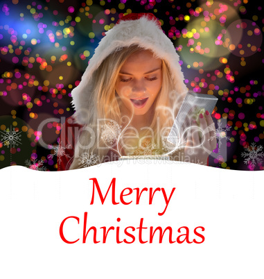 Composite image of sexy santa girl opening gift