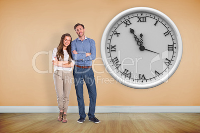 Composite image of smiling young couple with arms crossed