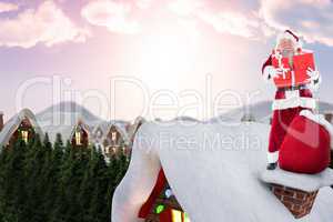 Composite image of santa on cottage roof