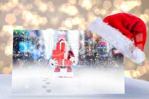 Composite image of santa hat on poster