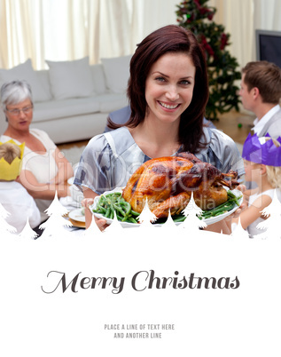 Composite image of woman showing christmas turkey for family din