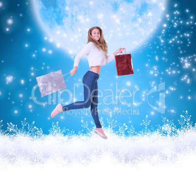 Composite image of pretty blonde with shopping bags