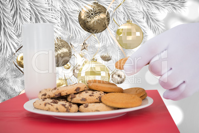 Composite image of hand of santa taking cookie